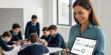 A middle school teacher stands in a classroom, looking at a Gimkit report on a tablet with a focused and positive expression. The report displays charts and data showing student performance, symbolizing the use of Gimkit for a pre-unit diagnostic to identify knowledge gaps.