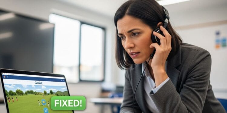 High-quality, photo-realistic image of a frustrated teacher troubleshooting Gimkit audio problems on a laptop in a classroom, with a subtle 'FIXED' icon symbolizing the 12 step solution