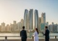 Abu Dhabi Golden Visa requirements explained with professionals and investors overlooking Abu Dhabi skyline in 2026